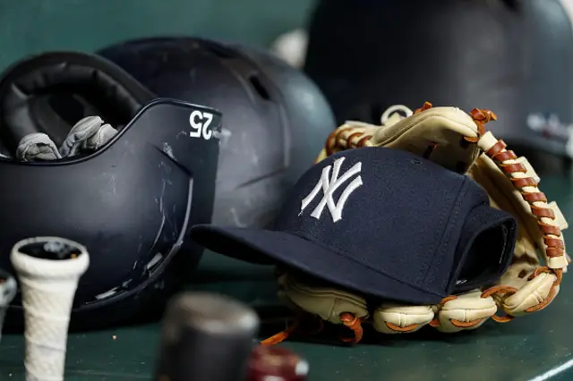 A New York Yankees hat and glove