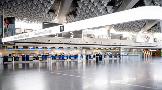 Empty check-in desks at Frankfurt airport, Germany