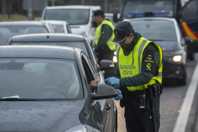 Spanish police patrol the border with France on 17 March