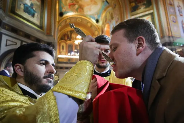 Worshippers take part in a service in a Russian Orthodox church