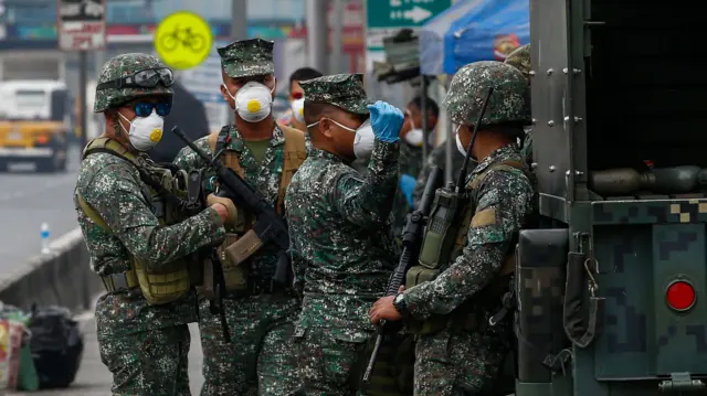 Philippine Marines deployed to assist police at the quarantine border of Rizal province and Pasig City, Metro Manila, Philippines, 16 March 2020.