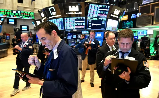 Traders work during the closing bell at the New York Stock Exchange earlier this week