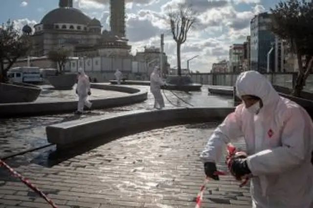 Employees from Istanbul Municipality clean and disinfect areas around Taksim Square, Turkey