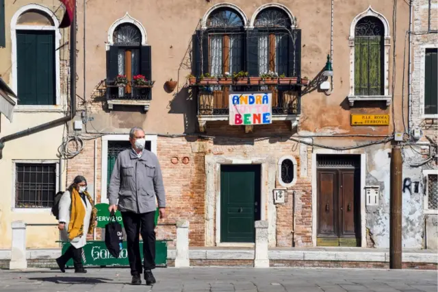 People walk in Venice