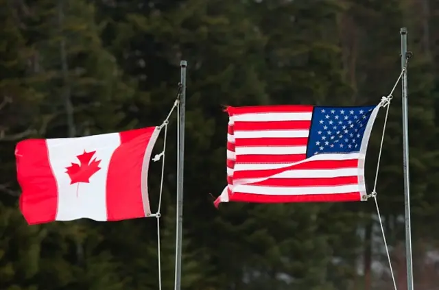 Canadian and American flags