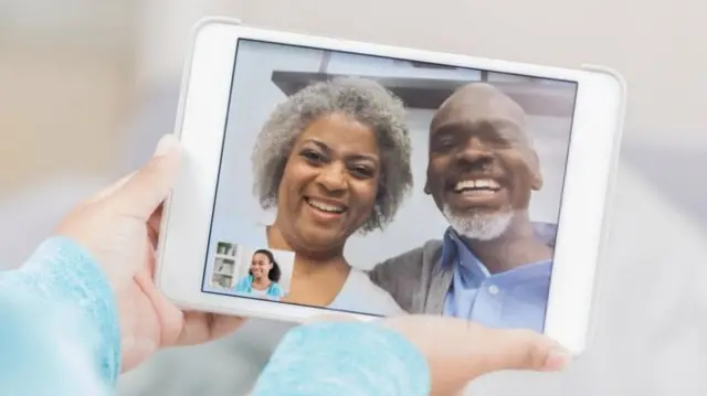 Older couple appearing on tablet screen