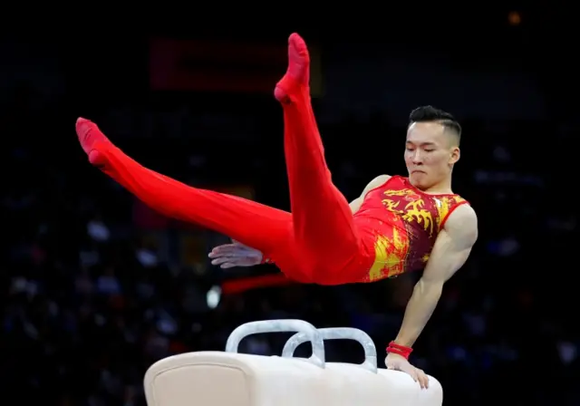 FILE PHOTO: Artistic Gymnastics - 2019 World Artistic Gymnastics Championships - Men"s Team Final - Pommel Horse - Hanns-Martin-Schleyer-Halle, Stuttgart, Germany - October 9, 2019 China"s Xiao Ruoteng in action