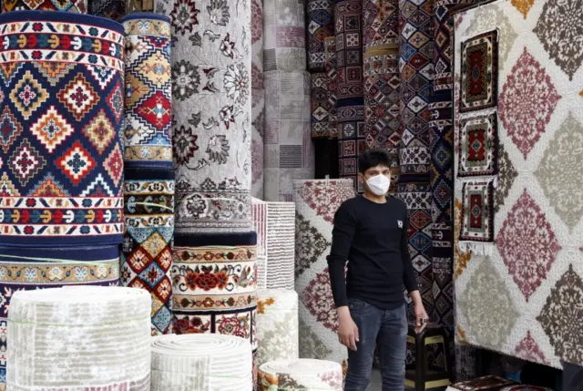 A carpet seller at a bazaar in Tehran, Iran (18 March 2020)