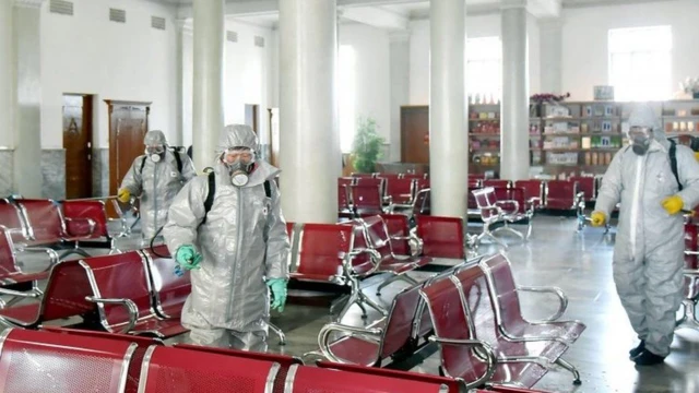 Health workers disinfecting