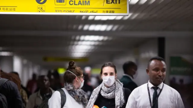 A passenger wears a mask following an outbreak of coronavirus in China at Addis Ababa Bole International Airport