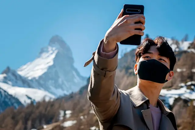 A man takes a selfie in Switzerland