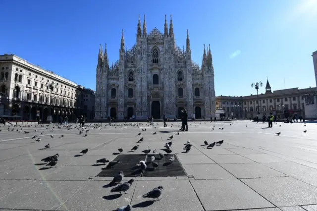 This picture taken on February 28, 2020, shows an almost empty piazza del Duomo in center Milan