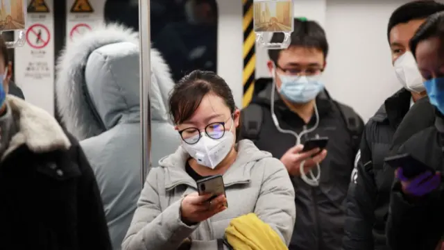 People wearing masks on the subway in Nanjing, eastern China