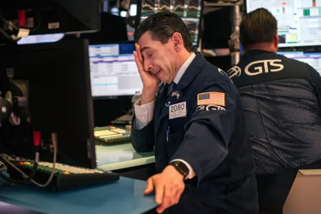 Traders at the New York Stock Exchange on Friday as markets plunged