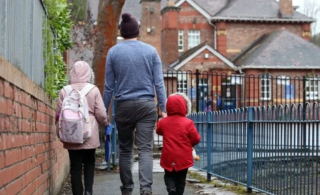 Children being walked to school