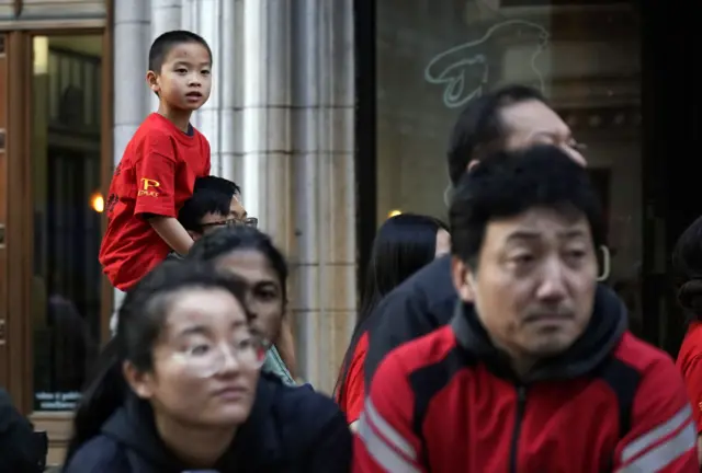 A young boy watches the Chinese New Year Parade, celebrating the Year of the Rat, in San Francisco, California