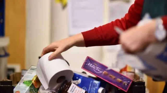 A woman at a food bank