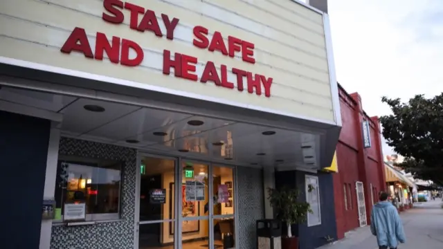 LA shop with sign 'Stay safe and healty'