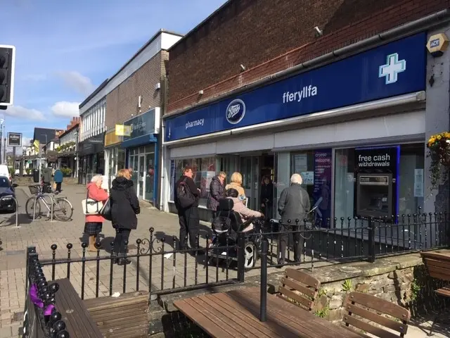 People queuing outside Boots