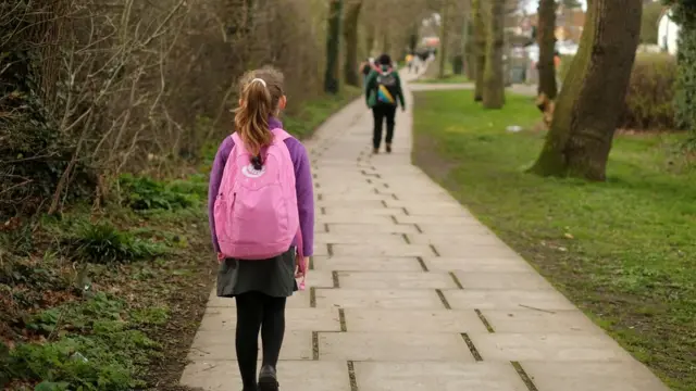 Girl walks to school