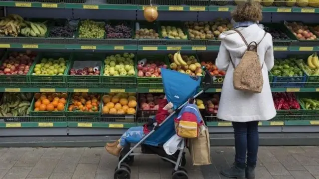 Woman looking at fruit