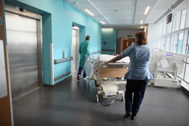 A patient is taken to the operating theatre in Birmingham's hospital. File photo