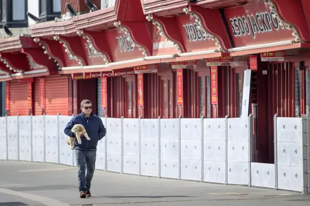 Closed amusement arcades line the sea front in the coastal town of Scarborough, North Yorkshire.