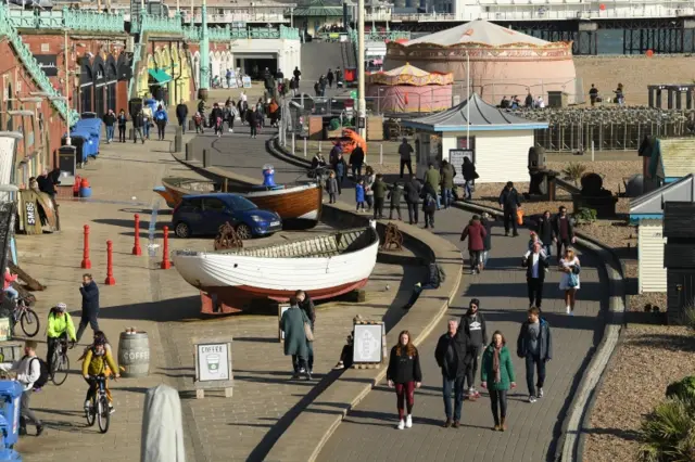 People enjoying the sunshine on March 22, 2020 in Brighton