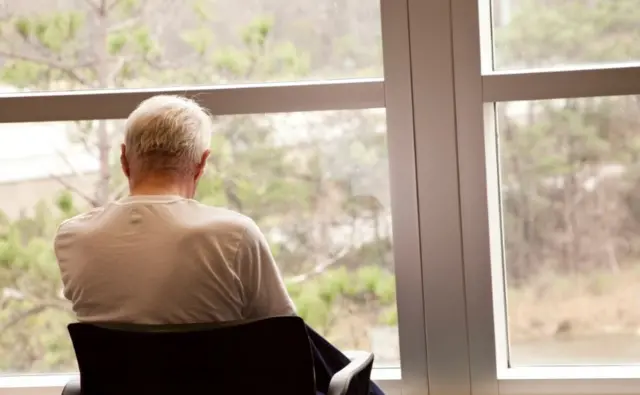 Man sitting at window