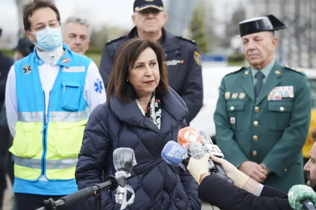 Minister of Defence Margarita Robles (R) is seen giving a press conference at the entrance of IFEMA, the exhibitions venue that will host a campaign hospital to assist coronavirus patients from Madrid hospitals on March 23, 2020 in Madrid, Spain