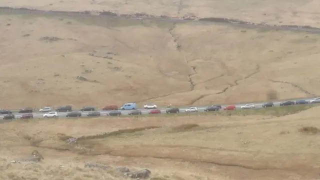 Cars parked on the side of the road in Snowdonia