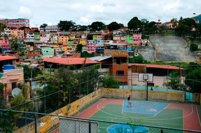 A child plays basketball in 23 de Enero neighbourhood in Caracas, photo taken in September 2019