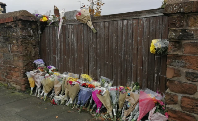 Flowers left after Phil Longcake's death