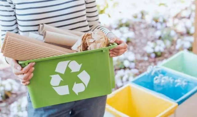 Woman recycling