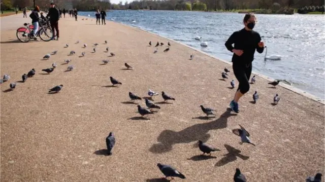 Jogger next to a lake