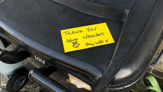 Bin with a note on it thanking refuse collectors