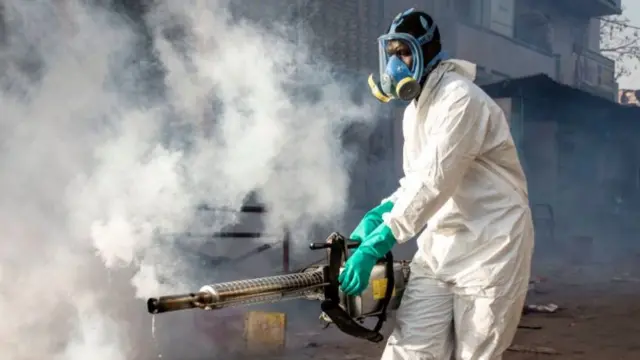 A municipal worker disinfects a neighbourhood in Dakar, Senegal