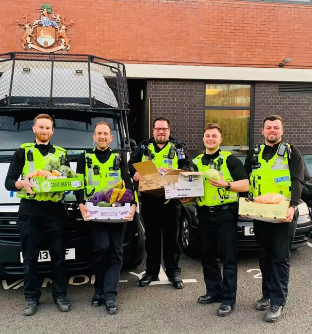 Police officers with donated food