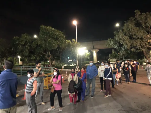 People queuing in Delhi