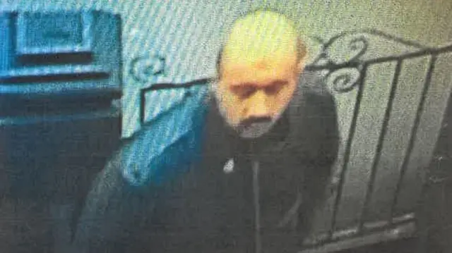 A CCTV image of a man