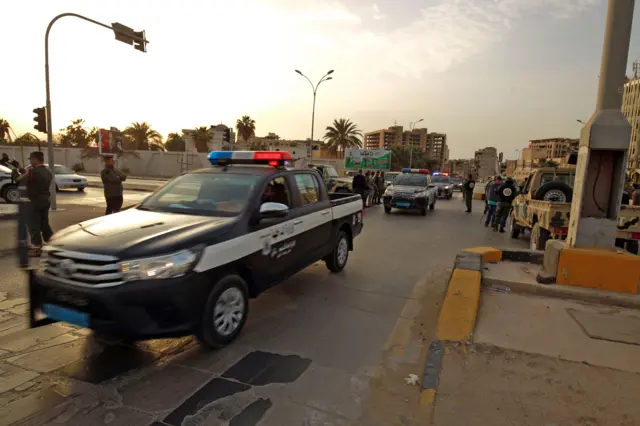 Police patrol the streets in Benghazi, Libya, during a state of emergency to combat the coronavirus disease