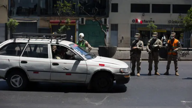 Police officers patrol the streets of Lima, Peru