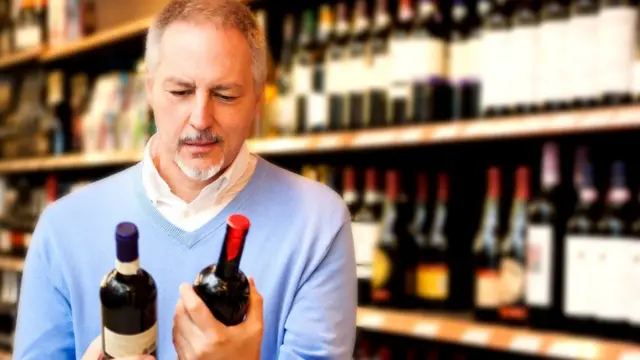 man choosing wine