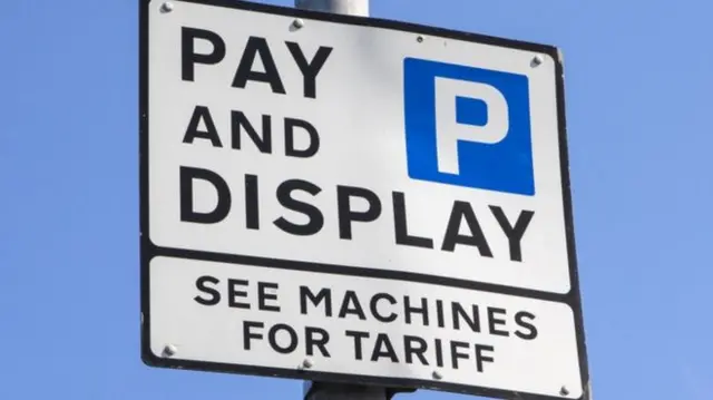 Parking charge sign