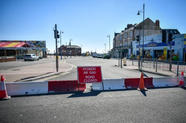 Road closed sign and an empty street