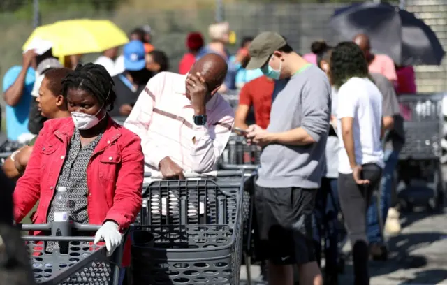 Shoppers in South Africa queuing - 24 March 2020