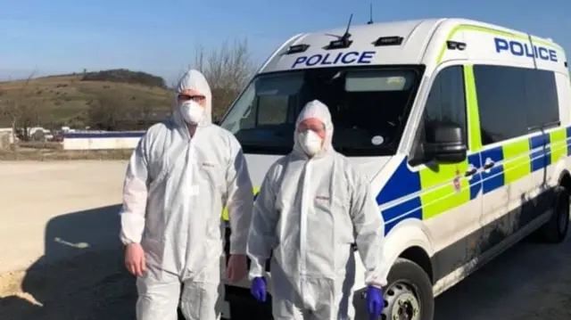 Police in protective clothing