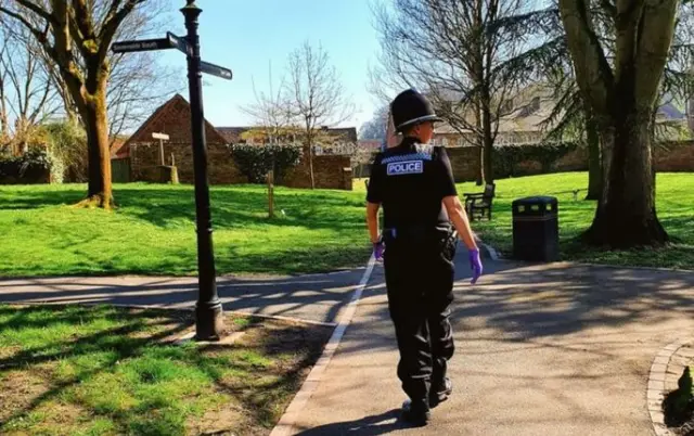 Policeman in empty park