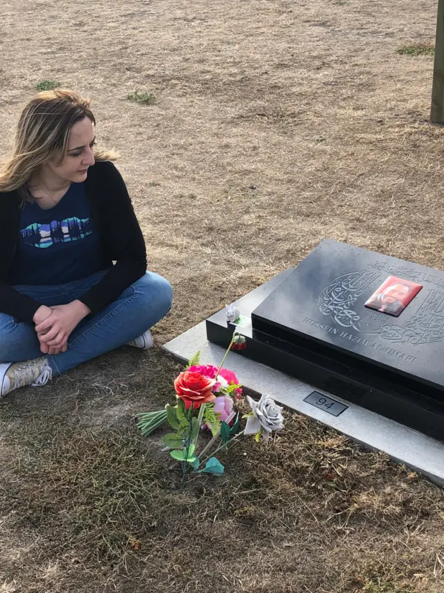 Aya Al-Umari at the grave of her brother, Hussein, in Christchurch, New Zealand, two weeks ago