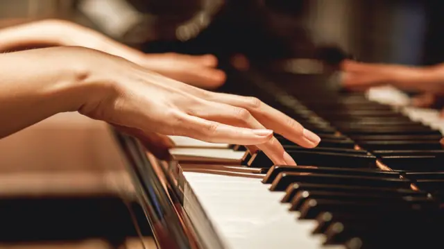 Person playing the piano